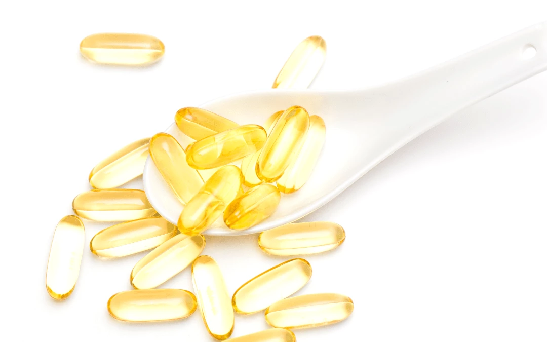 Fish Oil Capsules Spilling Off From A Spoon