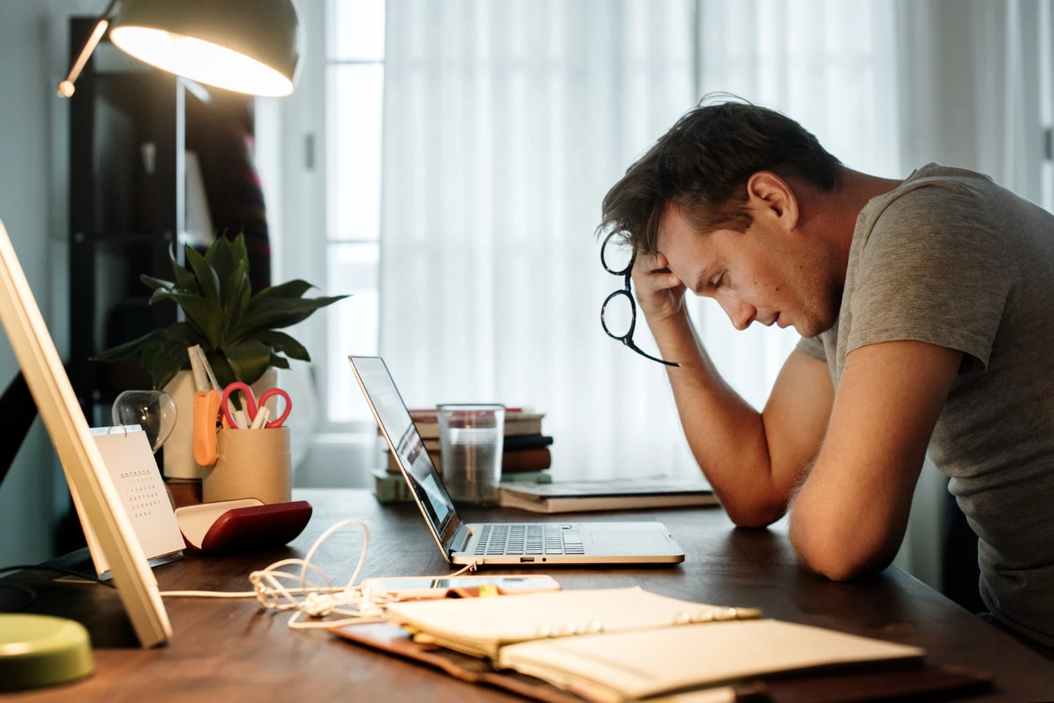 Man Stressed While Working Laptop