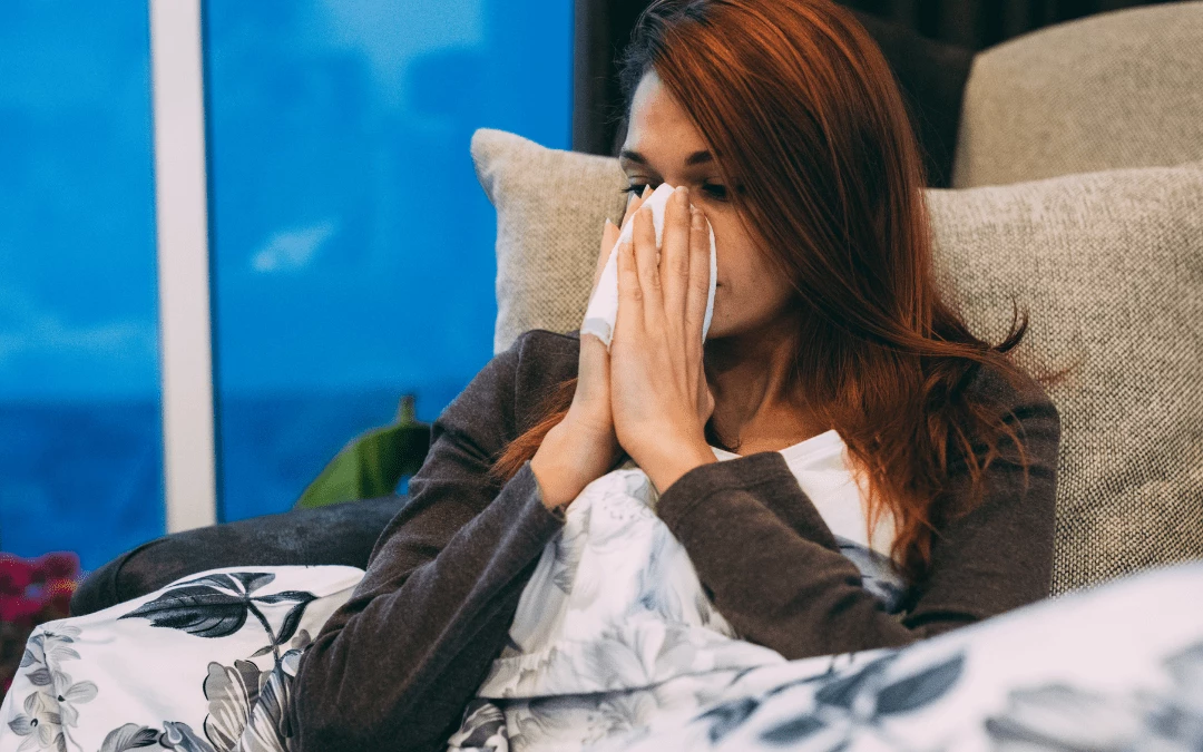 Sick Woman On Bed Blowing Out Her Runny Stuffy Nose