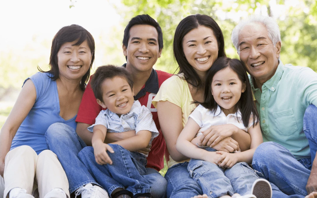 Happy Asian Family Smiling Together For A Picture