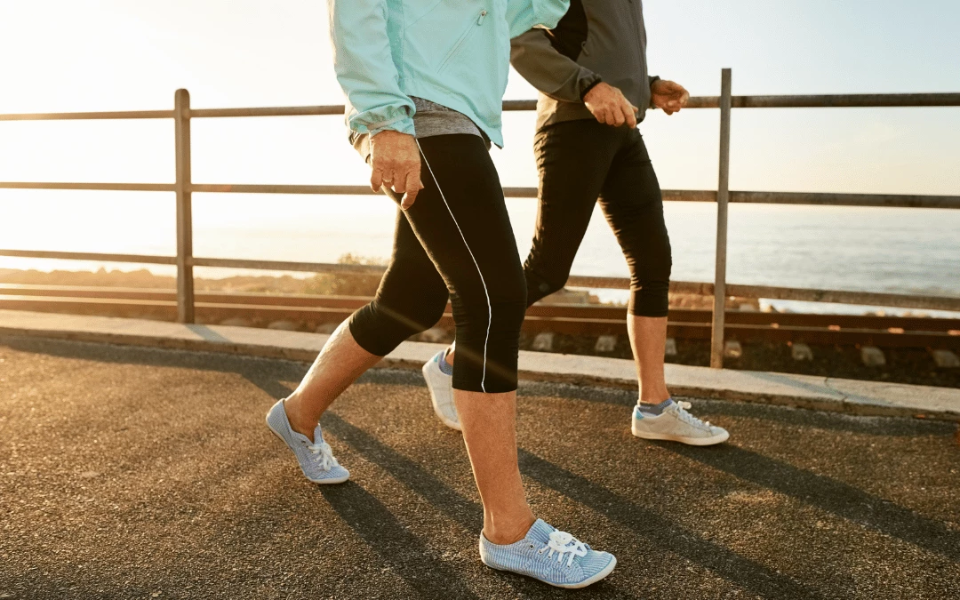 Two Half Body People Walking While Wearing Gym Sports Clothing And Sneakers