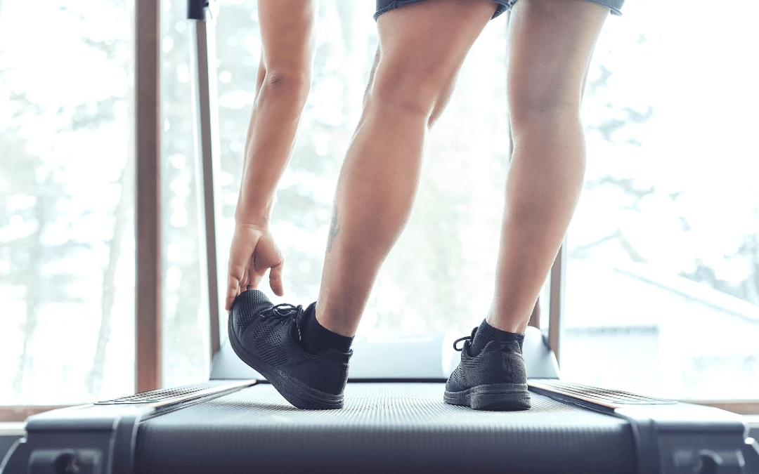 Half Body Man At Treadmill Stretching His Leg