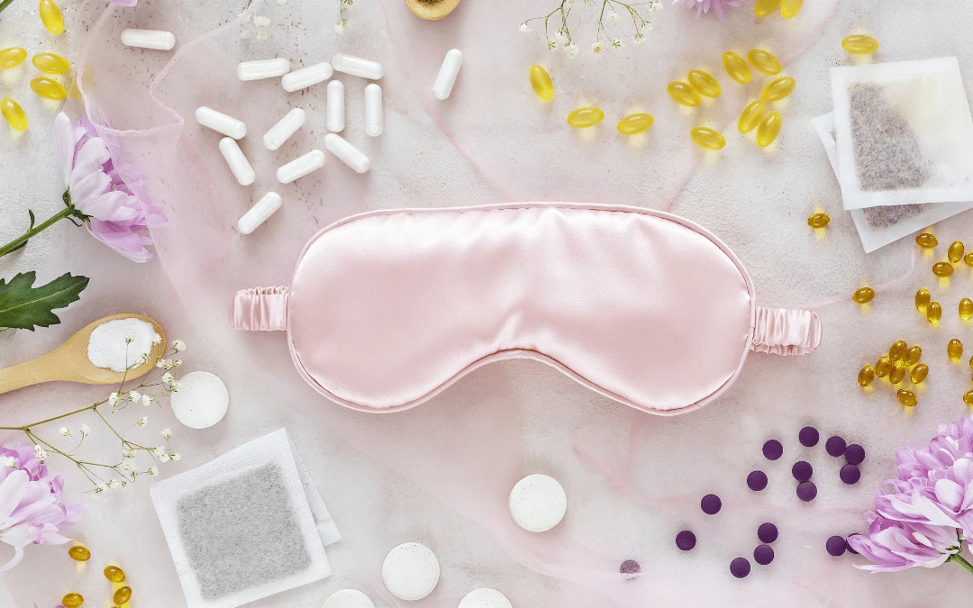 pink-sleeping-satin-fabric-eye-mask-cover-surrounded-with-diferent-types-colour-shape-of-pill-powder-supplements