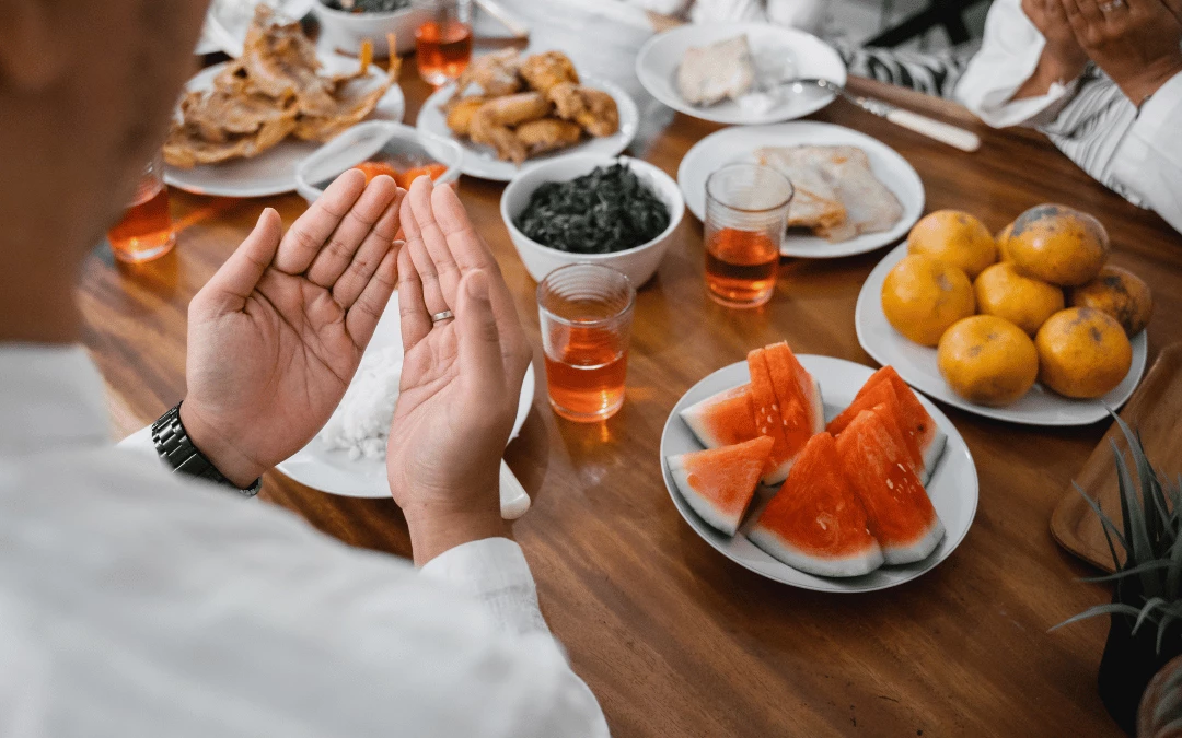 close-up-of-a-man-praying-on-a-table-full-of-food-during-sahur-time-on-ramadan